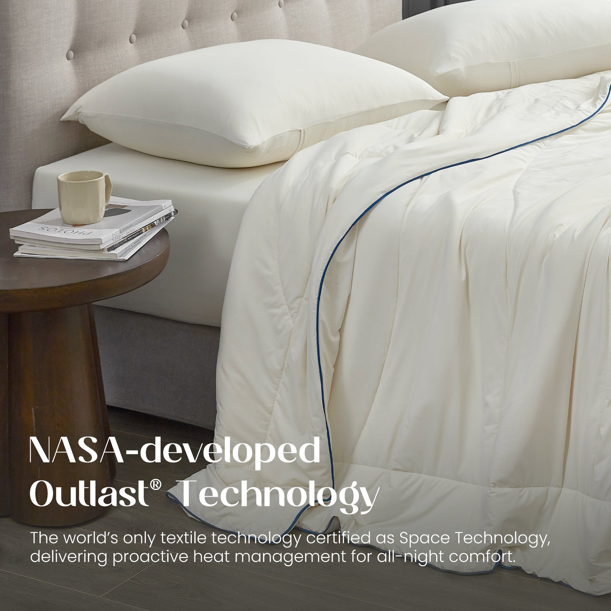 Bed with ivory bedding and pillows, featuring NASA-developed Outlast Technology text.#color_Ivory