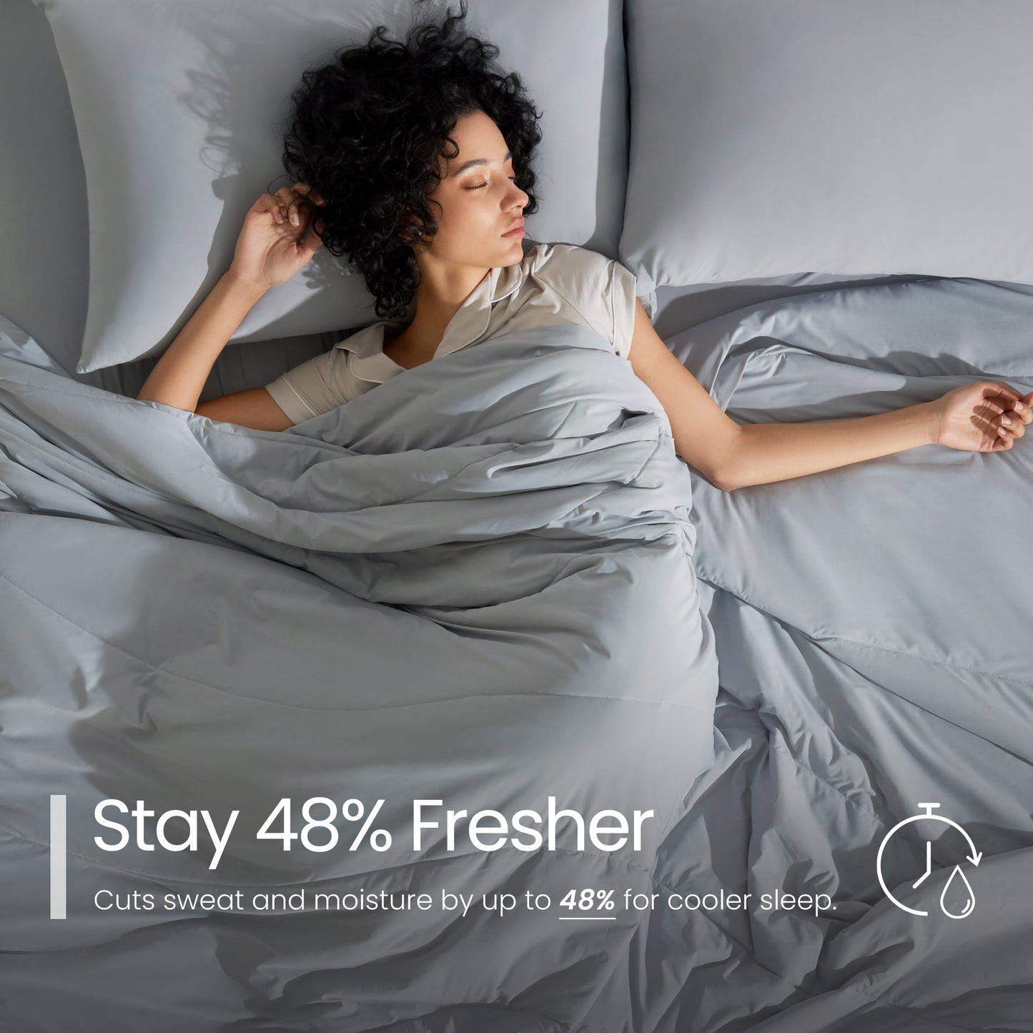 Woman sleeping under grey bedding with text about staying fresher#color_Light Grey