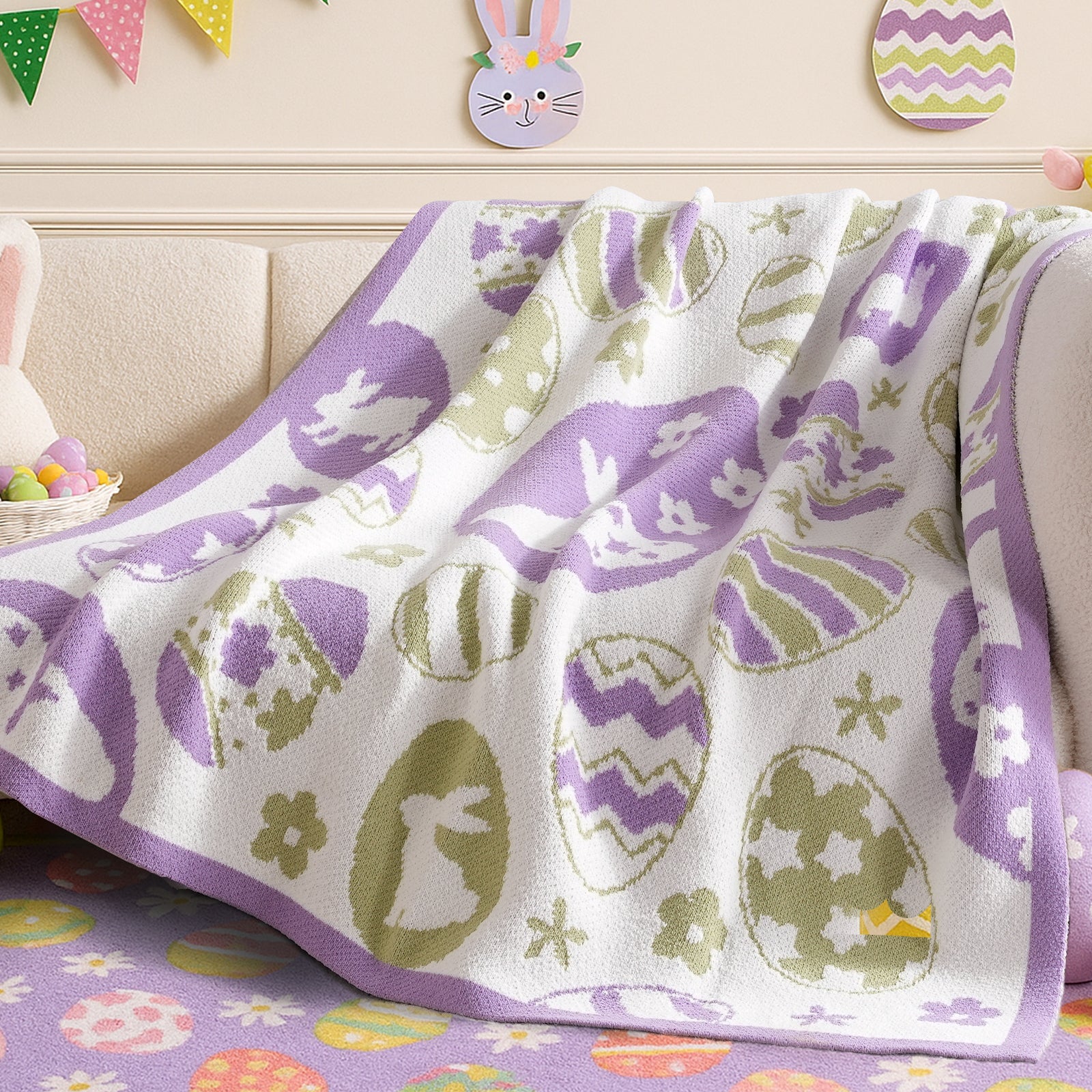 Easter Bunny and Eggs Chenille Knit Throw Blanket in Purple draped over a sofa, showcasing soft chenille texture and festive bunny and egg pattern design. #color_Purple