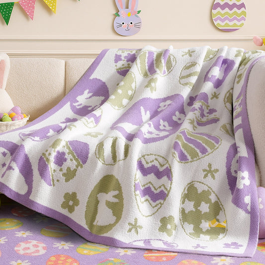 Easter Bunny and Eggs Chenille Knit Throw Blanket in Purple draped over a sofa, showcasing soft chenille texture and festive bunny and egg pattern design. #color_Purple