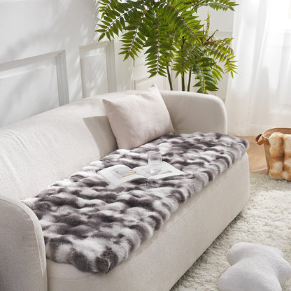 Tie-dye grey couch cover on a beige sofa with a plant in the background#color_Tie-dye Grey