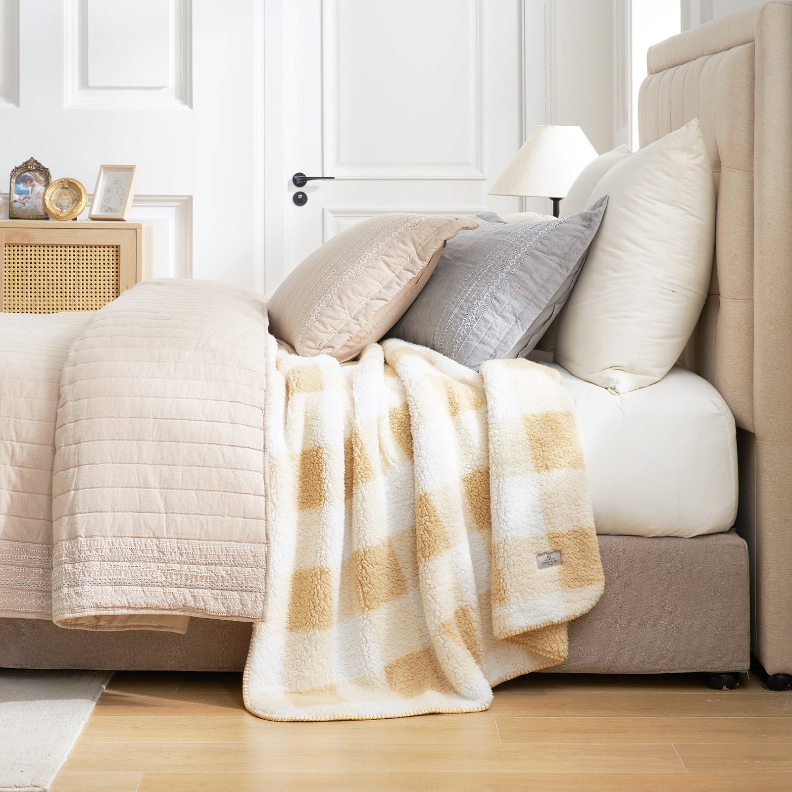 Buffalo sherpa throw blanket in Buffalo Plaid-beige draped over bed, creating a warm and cozy bedroom look #color_Buffalo Plaid-beige