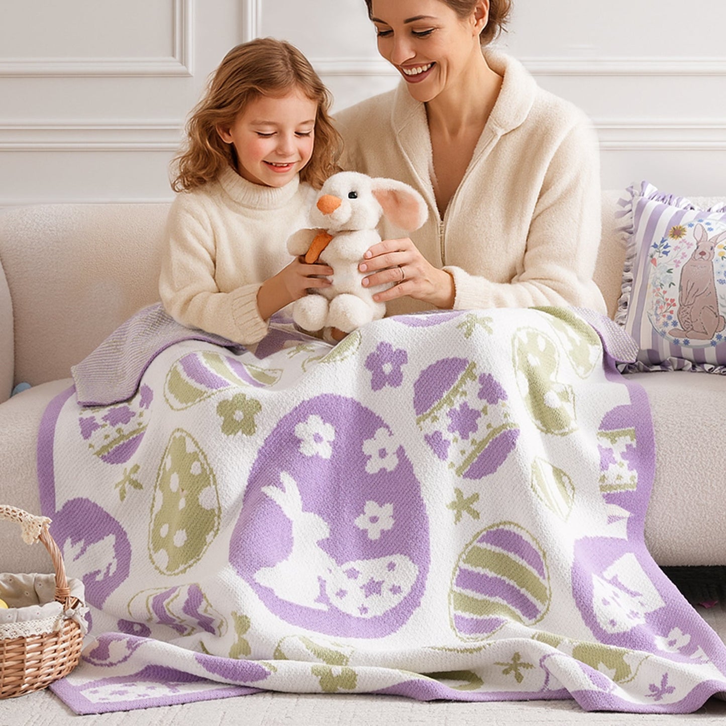Adult and child using Easter Bunny and Eggs Chenille Knit Throw Blanket in Purple on a sofa, enjoying cozy bonding moments in a playful home setting. #color_Purple
