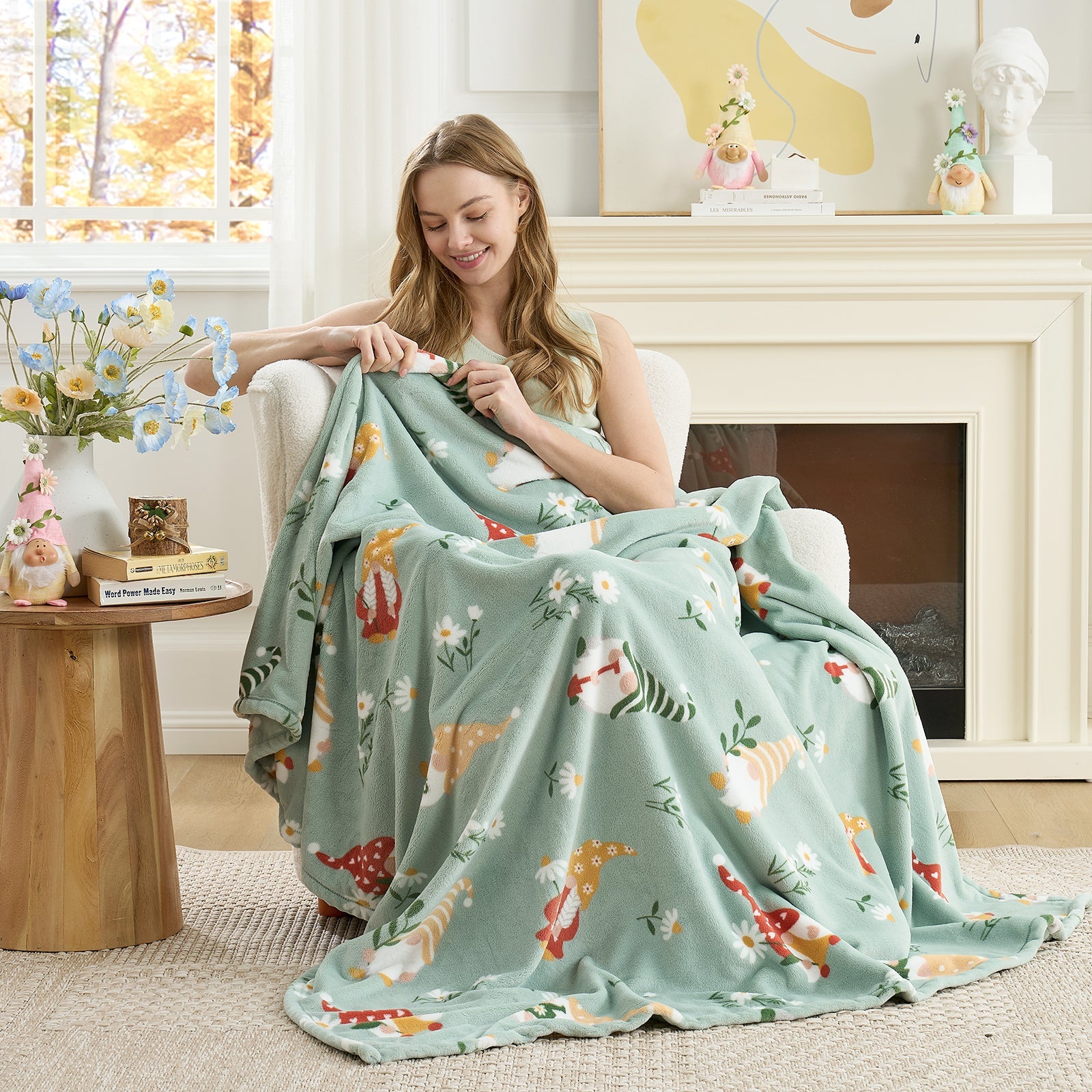 Woman relaxing on a chair with a spring gnomes milkyplush throw blanket in Green, enjoying soft and cozy comfort #color_Green