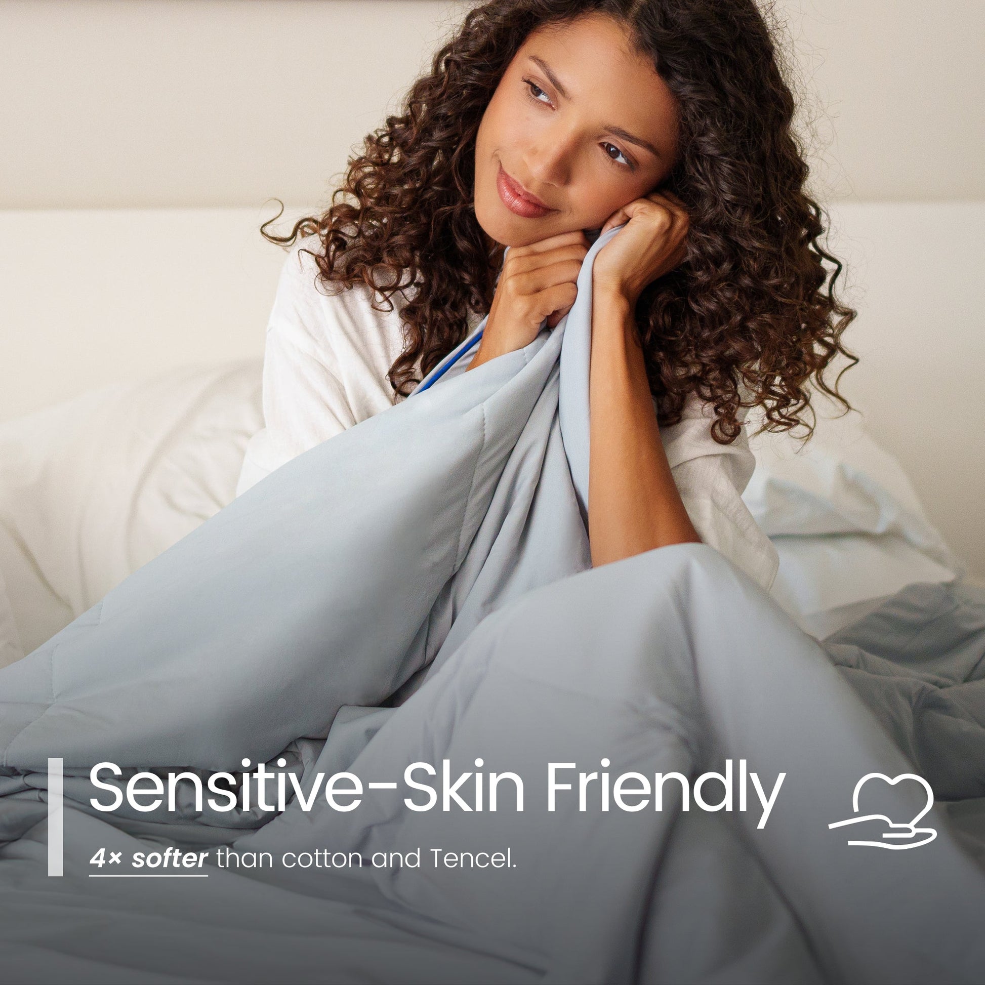 Woman wrapped in a blanket with 'Sensitive-Skin Friendly' text overlay#color_Light Grey