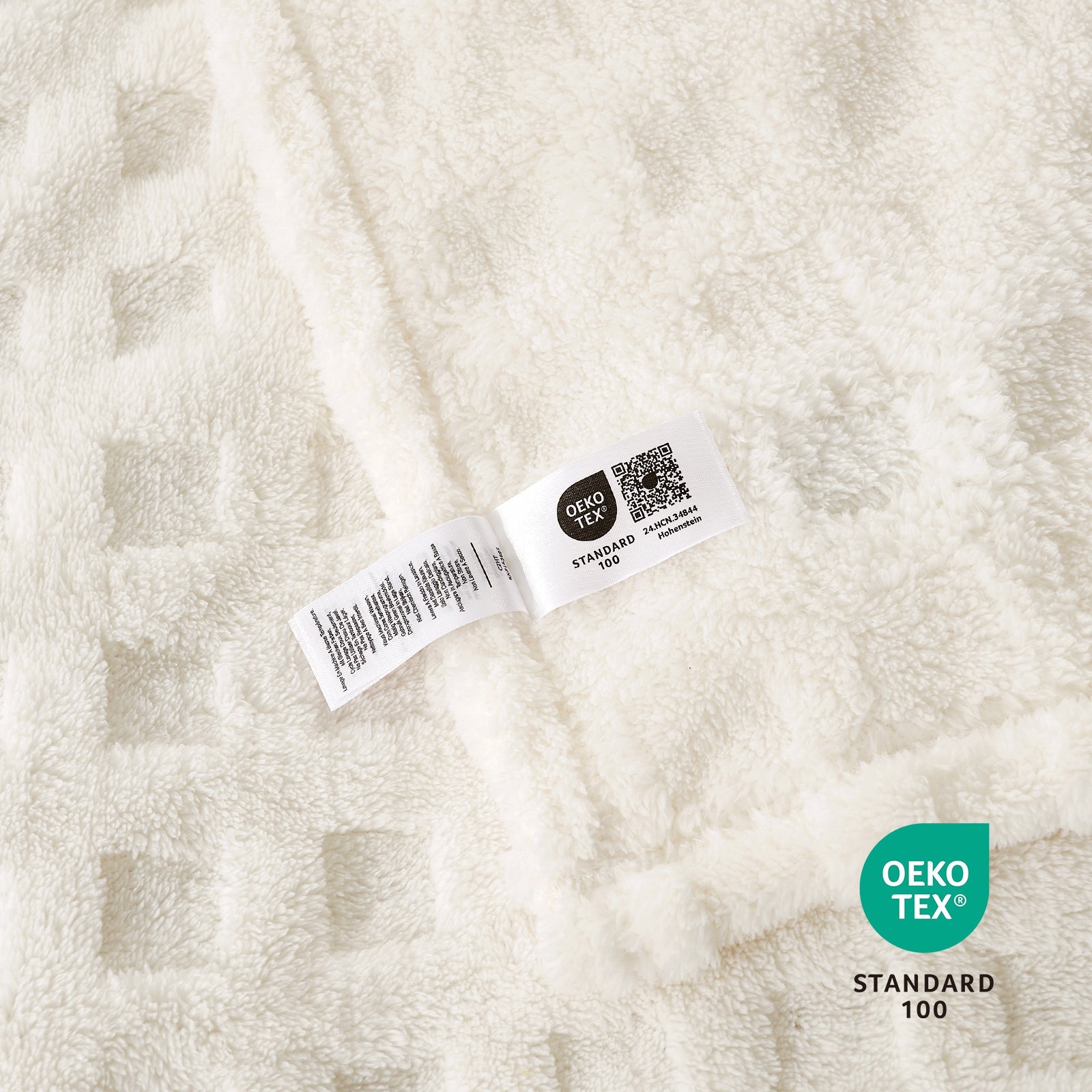 Close up of checkered waffle shaggy sherpa throw blanket in Ivory, showcasing soft texture and OEKO TEX STANDARD 100 certification #color_Ivory