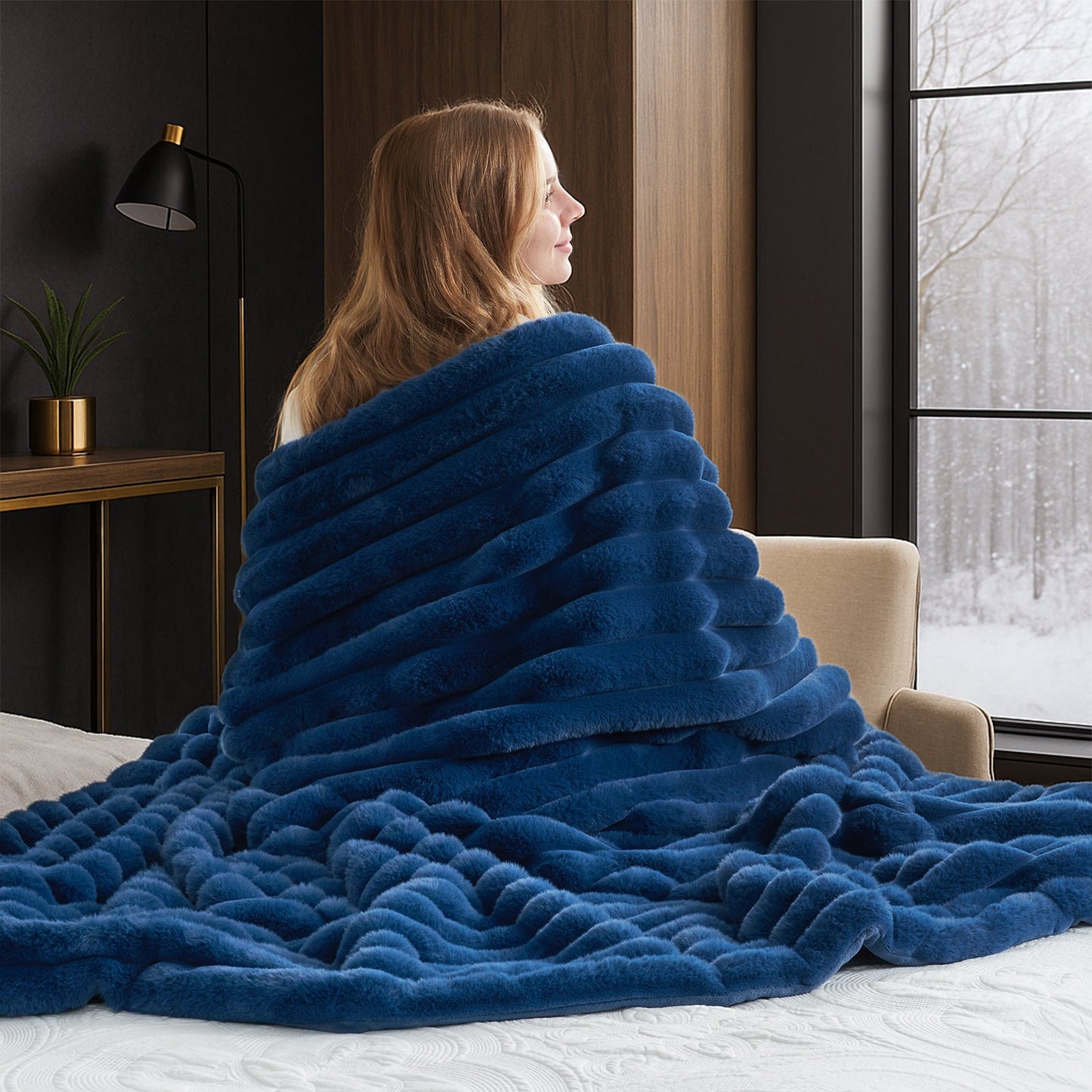 Woman wrapped in a fluffy navy blue striped faux fur throw blanket in a cozy room. #color_Navy Blue
