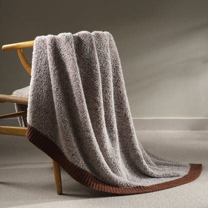 Faux Mink Feather Knit Throw Blanket in Brown draped over a chair, showcasing soft faux mink texture and warm knit design. #color_Brown