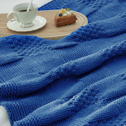 Close-up of Checkered Chenille Knit Throw Blanket in Blue showcasing textured chenille knit pattern with a cozy tea and dessert setting. #color_Blue