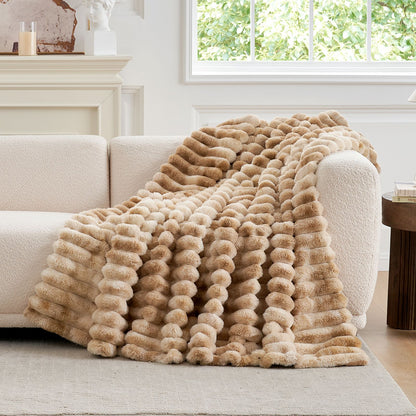 Cozy Bliss tie-dye beige striped faux fur blanket draped on a sofa. Cozy bedding and soft blanket. #color_Tie-dye Beige