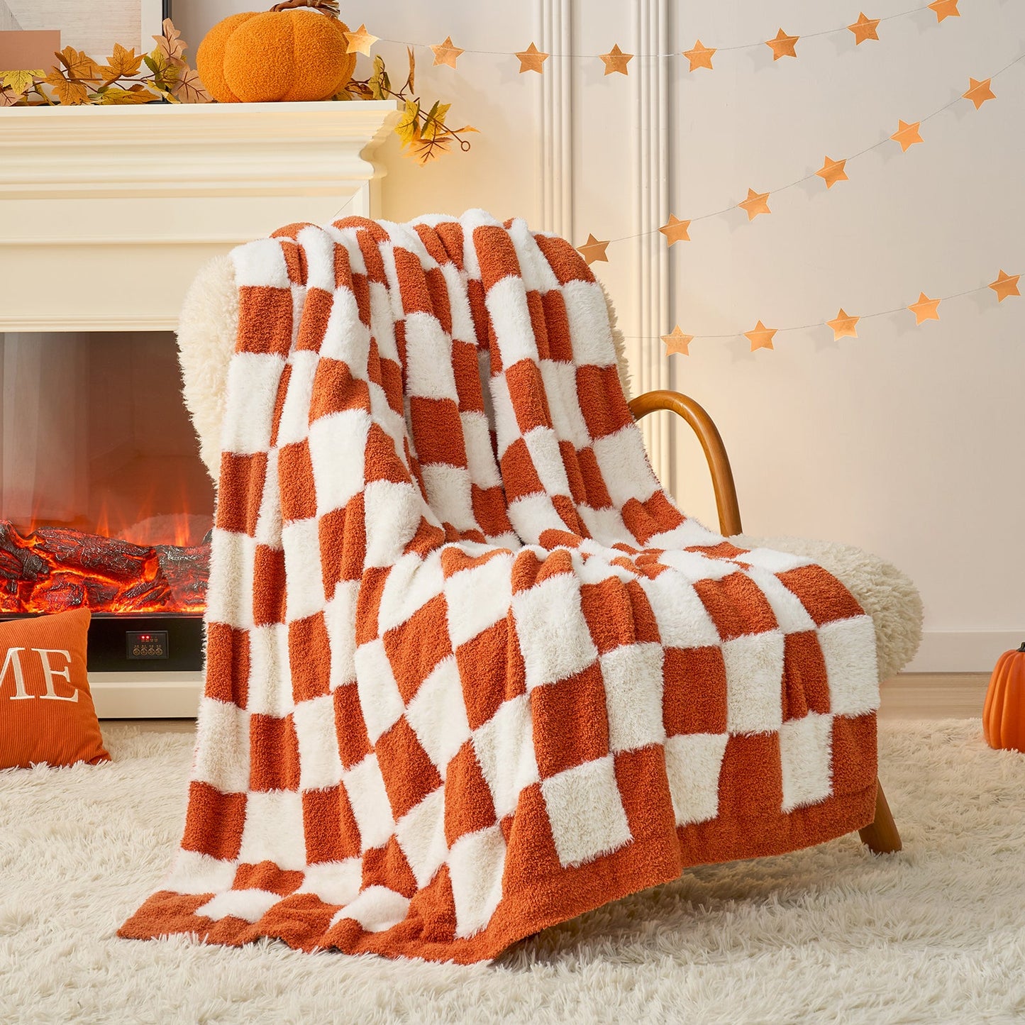 Checkered Faux Fur Feather Yarn Throw Blanket in Orange draped over an armchair, adding warmth and vibrancy. #color_Orange