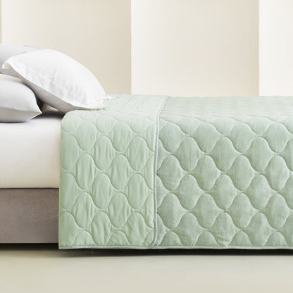 Cozy Bliss dual-sided cooling blanket in sage green with cloud pattern, premium comforter. #color_Sage Green