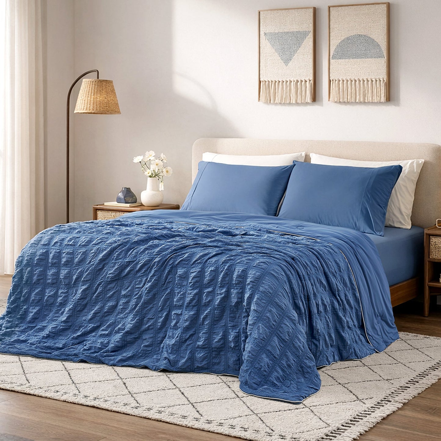 Cozy Bliss dark blue seersucker cooling comforter in bright cozy bedroom, breathable lightweight bedding with textured fabric.#color_Dark Blue