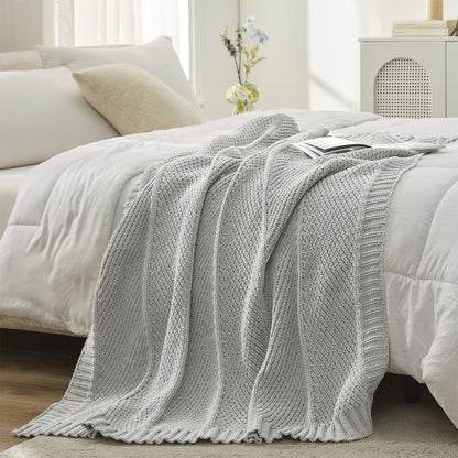 Chevron Chenille Knit Throw Blanket in Light Grey styled on a bed, adding a clean and modern layered look. #color_Light Grey