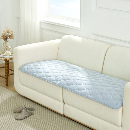 Blue couch cover on a white sofa in a living room setting.#Color_Cool Blue