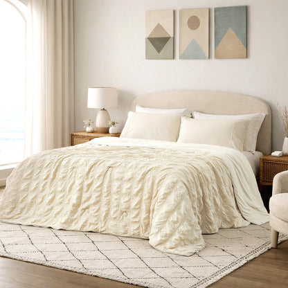 Cozy Bliss khaki seersucker cooling comforter in bright modern bedroom, breathable lightweight bedding with textured fabric.#color_Beige