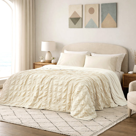 Cozy Bliss khaki seersucker cooling comforter in bright modern bedroom, breathable lightweight bedding with textured fabric.#color_Beige