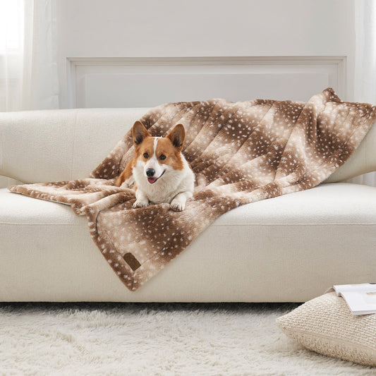 Cozy Bliss Leakproof Faux Fur Pet Blanket in deer print front view with a dog sitting on it. #color_Brown Sherpa Deer