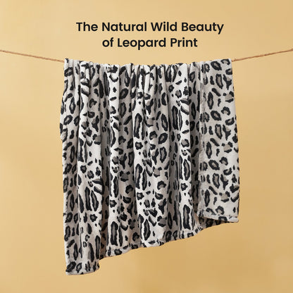 Leopard print milkyplush throw blanket in Silvery Leopard displayed hanging, highlighting natural animal print pattern #color_Silvery Leopard