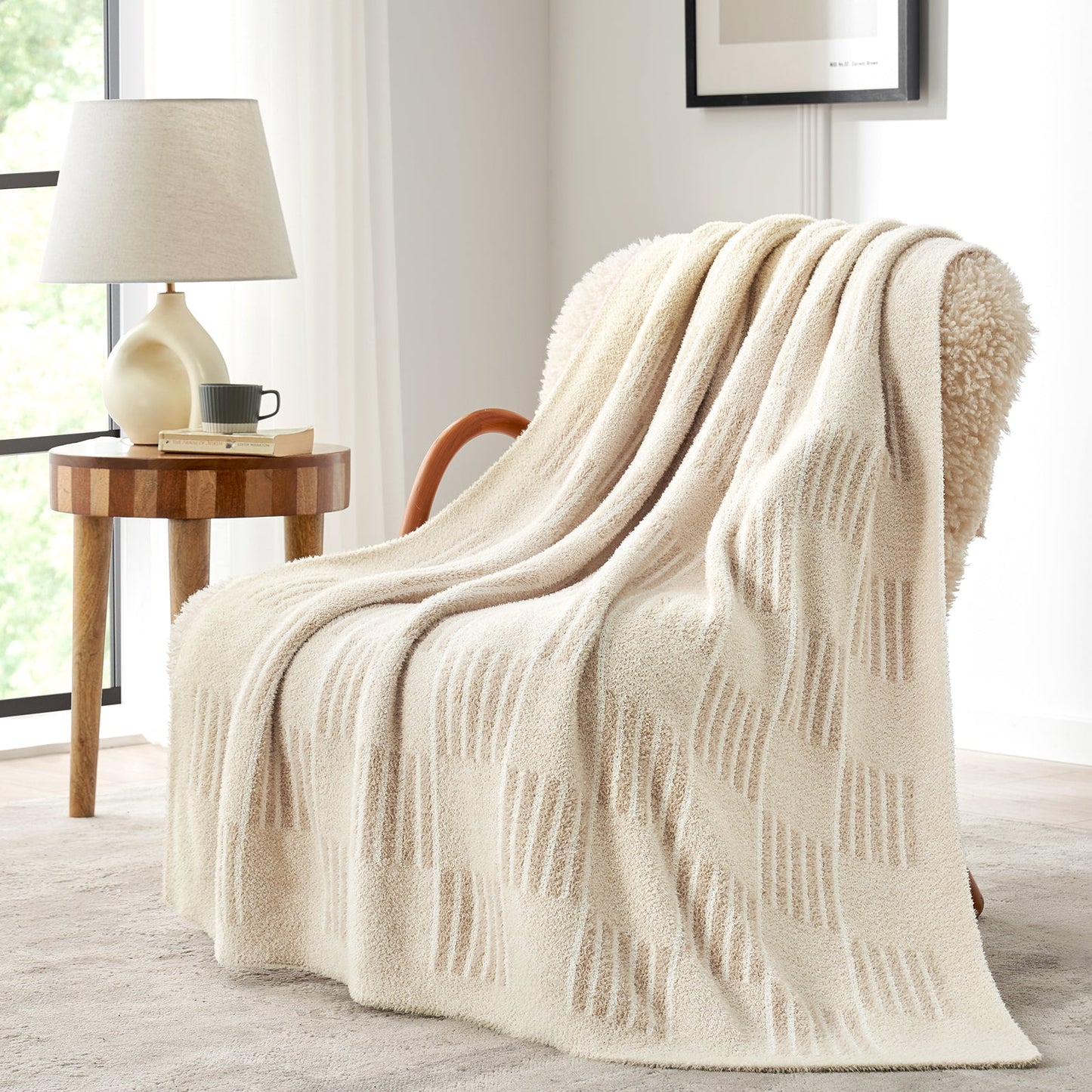 Reversible Heather Checkered Feather Yarn Throw Blanket in Cream White draped over an armchair, highlighting its soft feel and elegant checkered pattern. #color_Cream White
