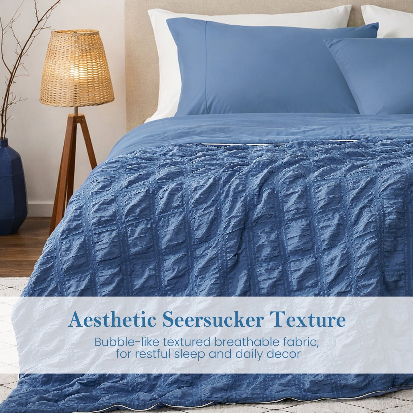 Close-up of dark blue seersucker comforter, textured breathable fabric with soft cooling touch.#color_Dark Blue