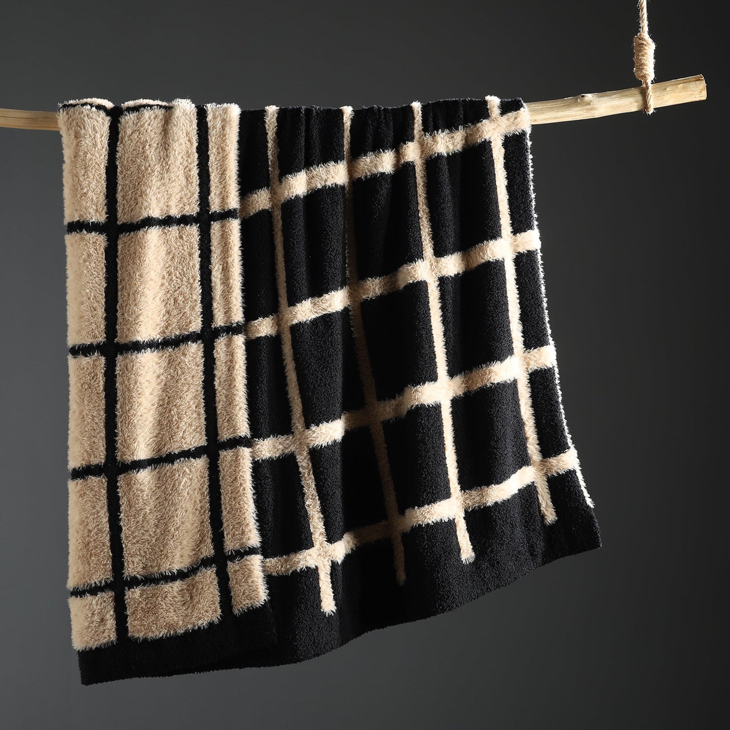Faux Mink Textured Plaid Knit Throw Blanket in Black front view hanging display, showcasing plush faux mink texture and plaid pattern design. #color_Black