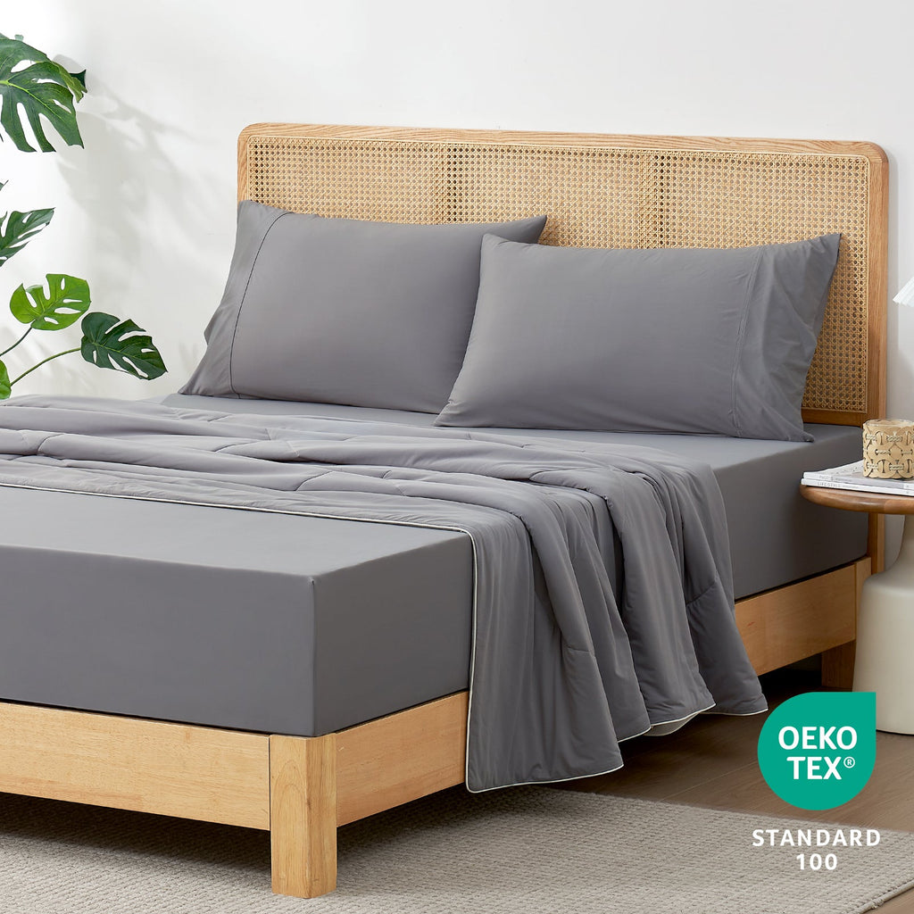 Gray cooling sheet set on bed with pillowcases. Ultra-soft and breathable, Oeko-Tex certified cozy bedding #Color_Dark Grey
