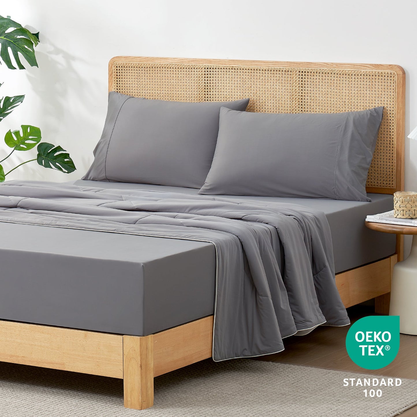 Gray cooling sheet set on bed with pillowcases. Ultra-soft and breathable, Oeko-Tex certified cozy bedding #Color_Dark Grey