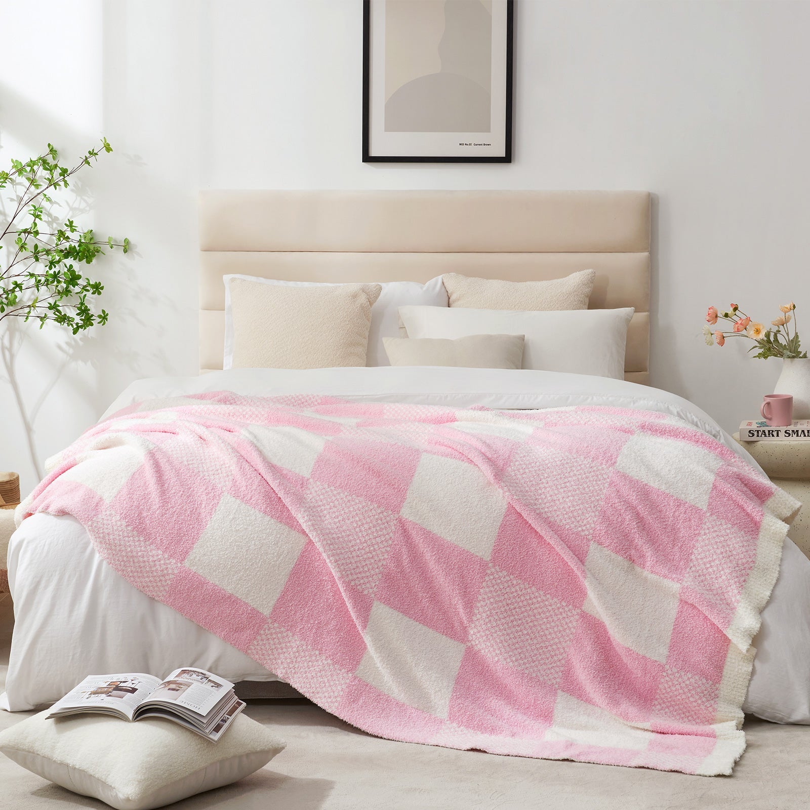 Checkered Feather Yarn Throw Blanket in Pink styled on a bed, adding a clean and cozy layered look to bedroom decor. #color_Pink