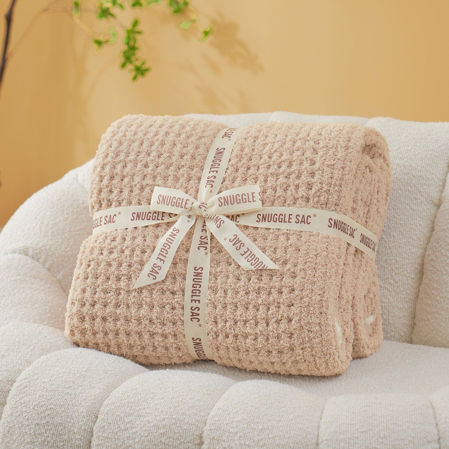 Soft Waffle Feather Yarn Throw Blanket in Beige neatly folded as gift packaging, ideal for gifting. #color_Beige