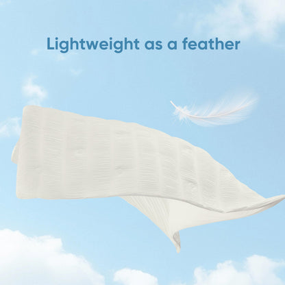 Cooling comforter floating in air, lightweight breathable fabric for cool and comfortable sleep.#color_Off White