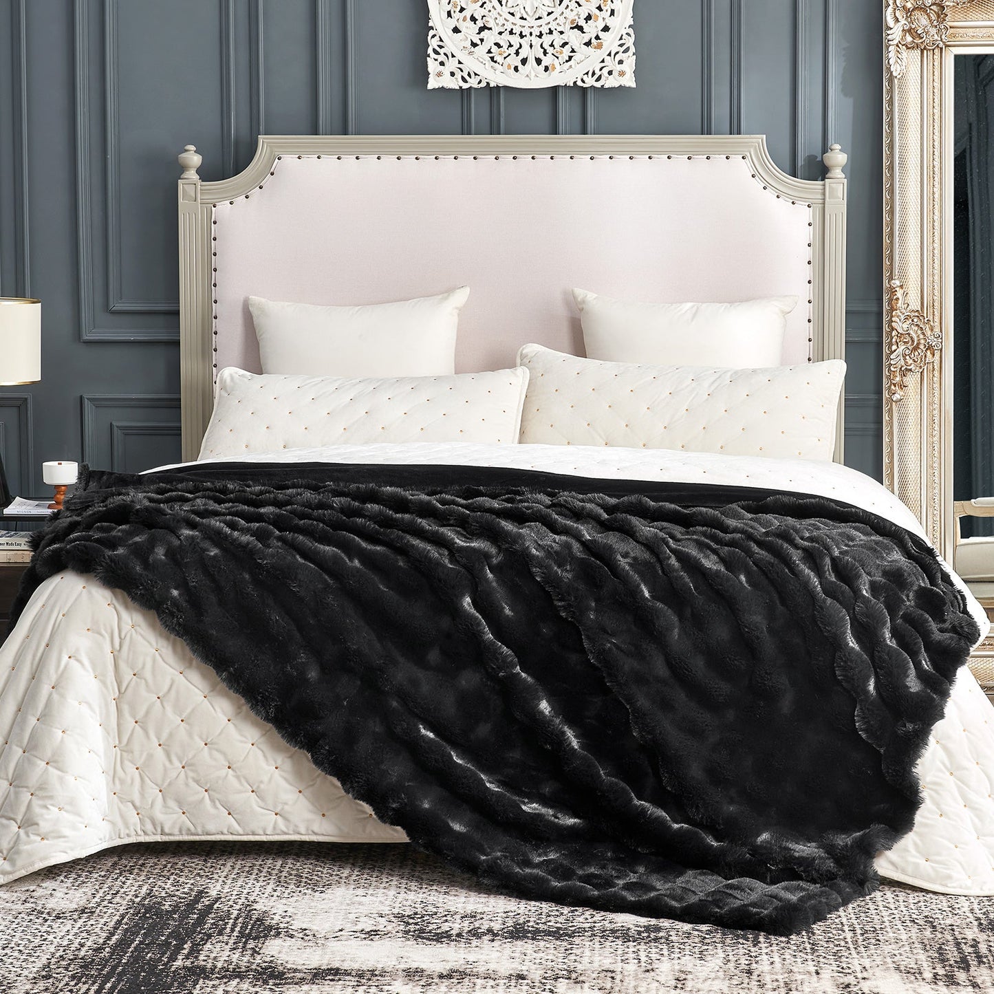 Cozy Bliss black faux fur throw blanket on bed. Cozy and soft blanket for bedroom. #color_Black