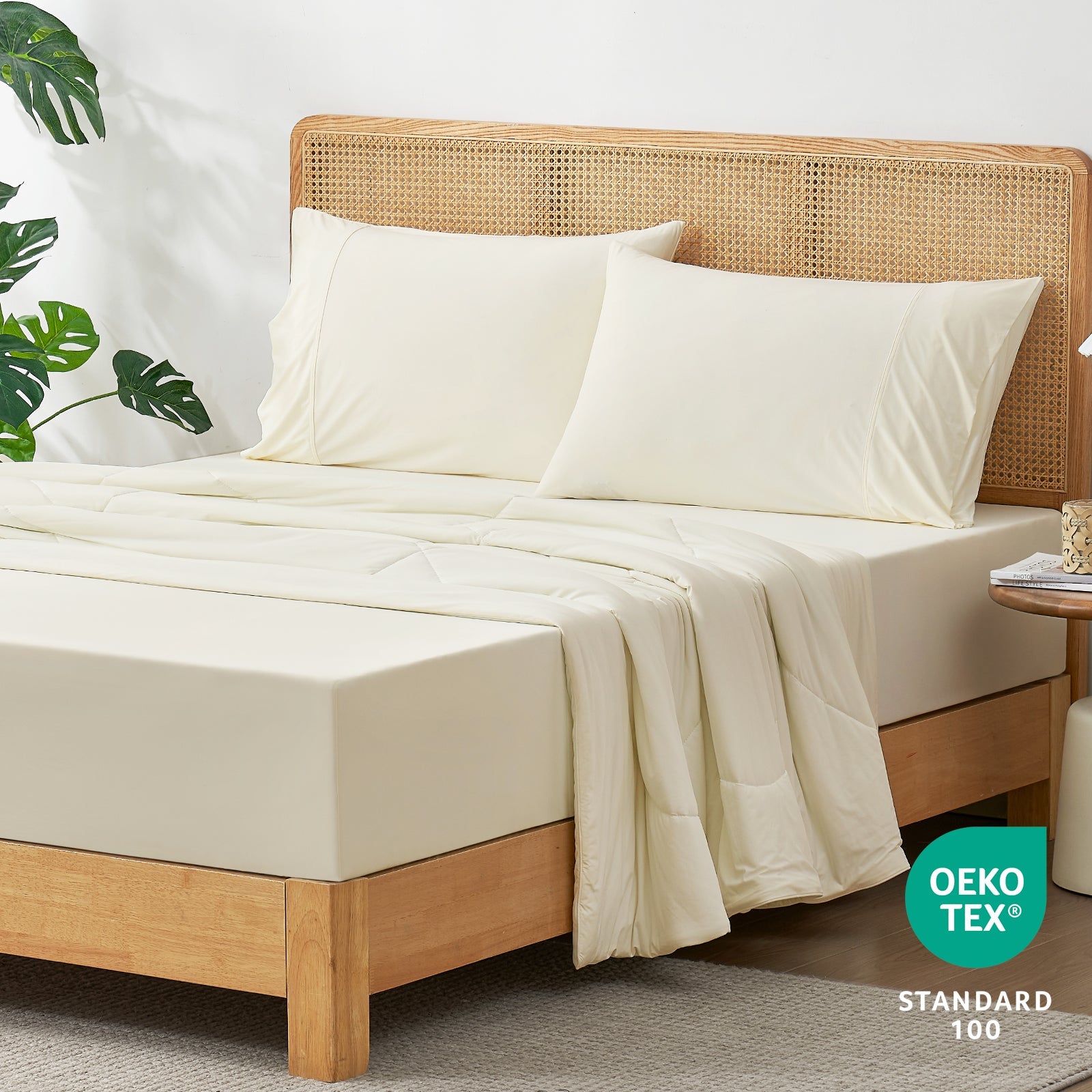 Cream cooling fitted sheet set with pillowcases on bed, OEKO-TEX certified, breathable and soft. #Color_Cream White