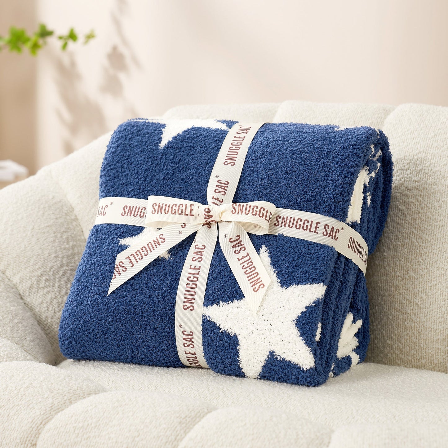 Reversible Star Feather Yarn Knit Throw Blanket in Heather Royal Blue neatly folded with ribbon, perfect as a cozy gift for holidays and special occasions. #color_Heather Royal Blue