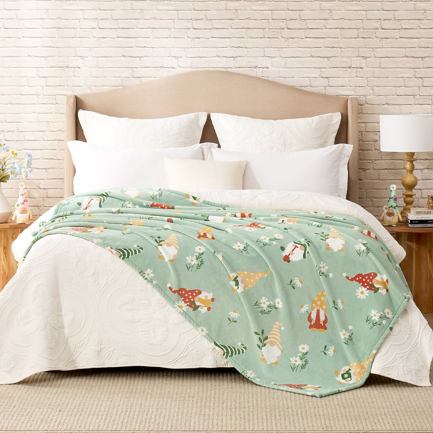 Spring gnomes milkyplush throw blanket in Green layered on a bed, creating a warm and playful bedroom look #color_Green