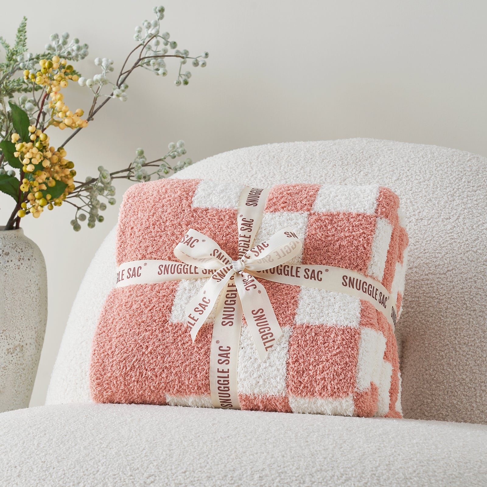 Checkered Feather Yarn Knit Throw Blanket in Pink neatly folded as gift packaging, perfect for holidays and special occasions. #color_Pink
