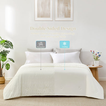Double-sided cooling comforter, ivory seersucker on bed, breathable and soft design for cozy sleep #color_Cream White
