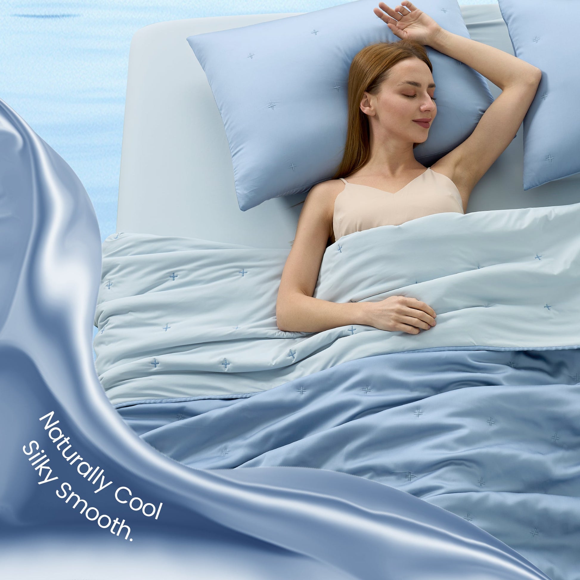 Woman sleeping peacefully under blue silky smooth Tencel™ lyocell cooling comforter.#Color_Dark Blue