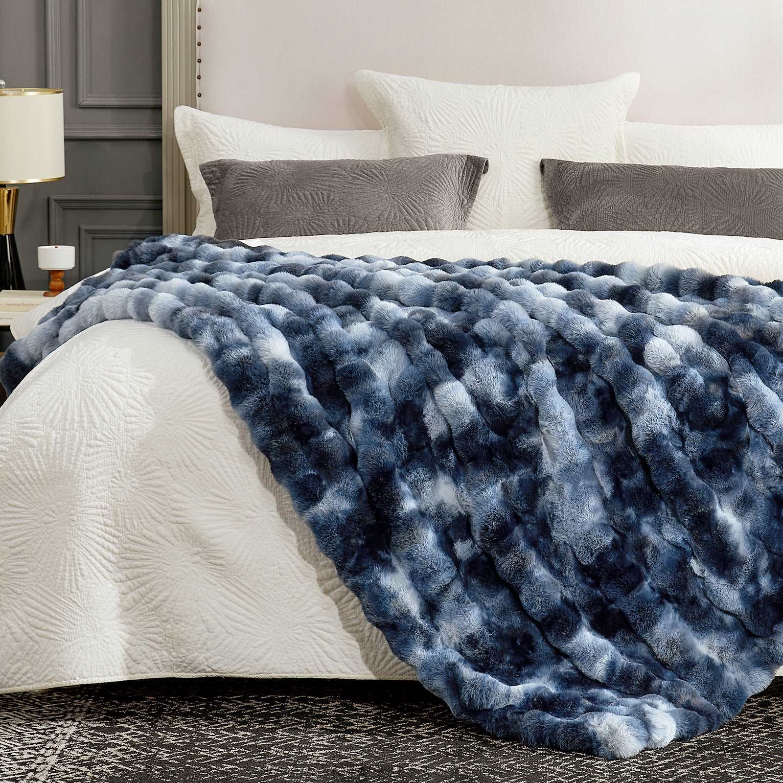 Tie-dye blue faux fur blanket on cozy bed. Cozy and soft blanket for bedroom comfort.  #color_Tie-dye Blue