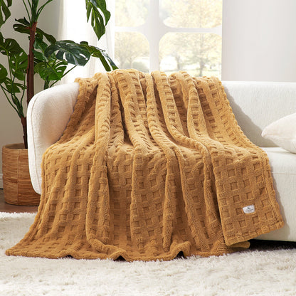 Checkered waffle shaggy sherpa throw blanket in Brown draped over a sofa, creating a soft and cozy living space #color_Brown