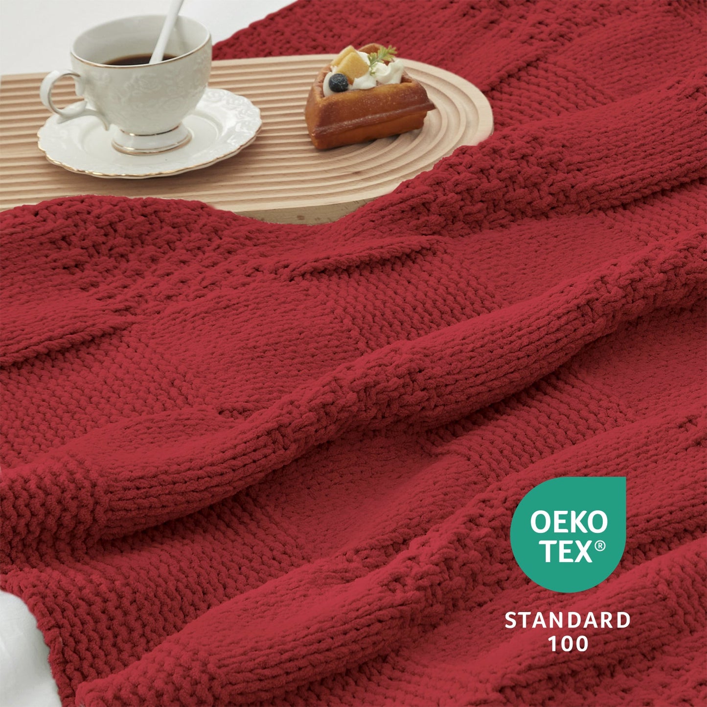 Close-up of Checkered Chenille Knit Throw Blanket in Red showcasing textured chenille knit pattern with a cozy tea and dessert setting. #color_Red