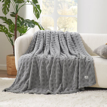 Checkered waffle shaggy sherpa throw blanket in Light Grey draped over a sofa, creating a soft and cozy living space #color_Grey