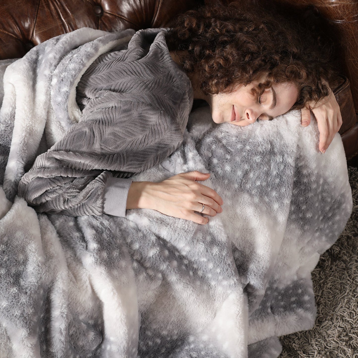 Person wrapped in a gray blanket on a couch   #color_Silver Sherpa Deer
