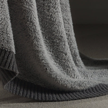Close-up of faux mink texture on Faux Mink Feather Knit Throw Blanket in Grey highlighting soft plush fibers and cozy feel. #color_Grey