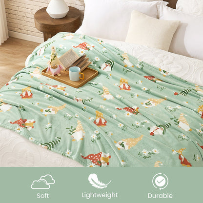 Spring gnomes milkyplush throw blanket in Green displayed on bed, highlighting soft lightweight and durable features #color_Green