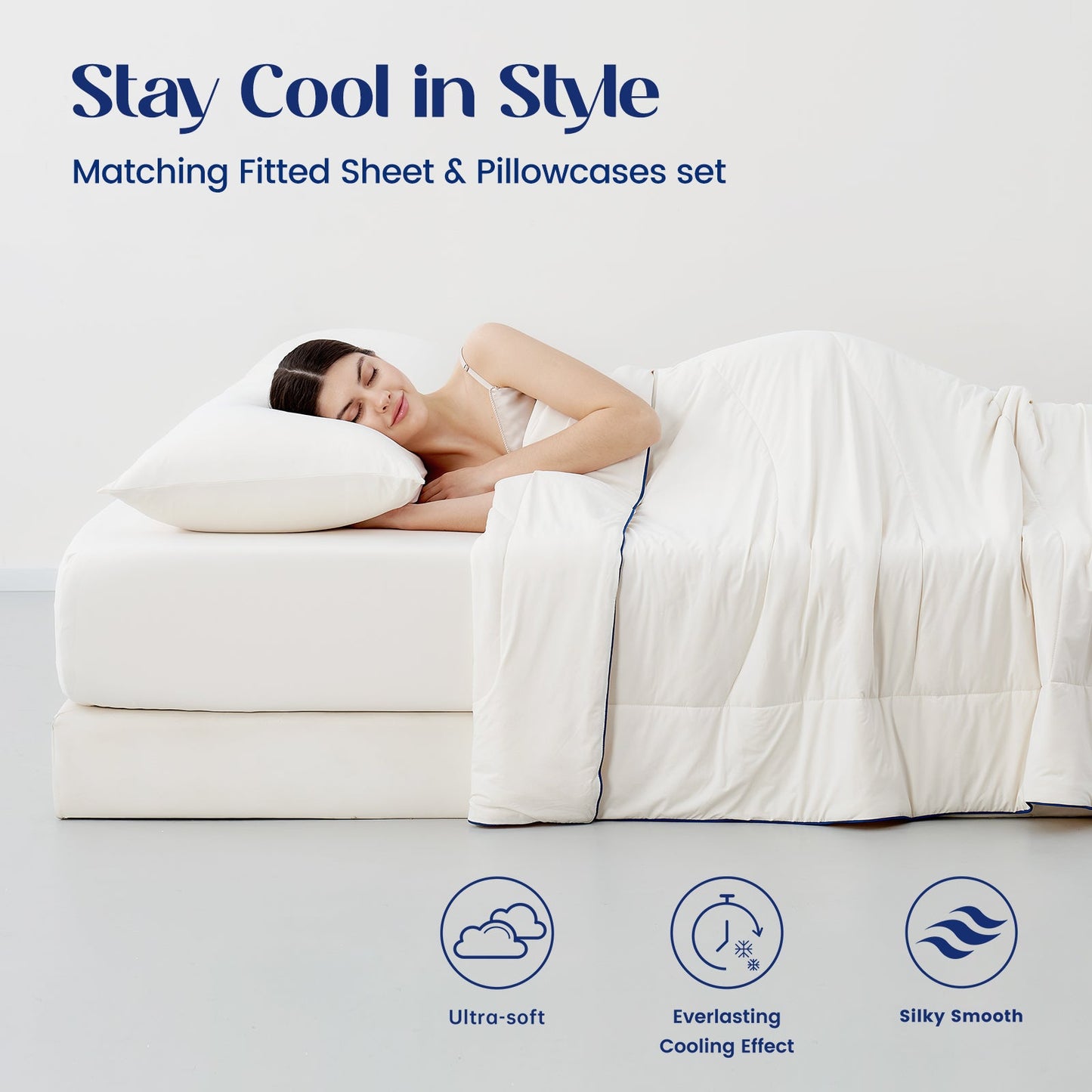 Woman lying on a cooling sheet set   with matching fitted sheet and pillowcases set.#color_Ivory