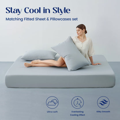 Woman lying on a cooling sheet set   with matching fitted sheet and pillowcases set.#color_Light Grey