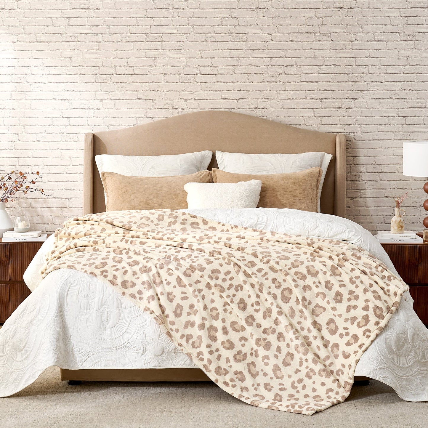 Leopard print milkyplush throw blanket in Khaki Leopard layered on a bed, creating a warm and stylish bedroom look #color_Khaki Leopard
