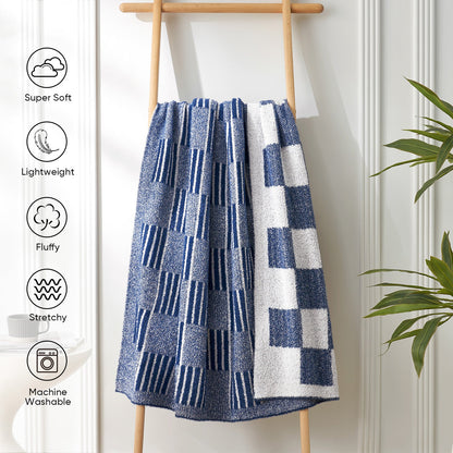Reversible Heather Checkered Feather Yarn Throw Blanket in Navy displayed on a rack, featuring super soft, lightweight, fluffy and machine washable design. #color_Navy