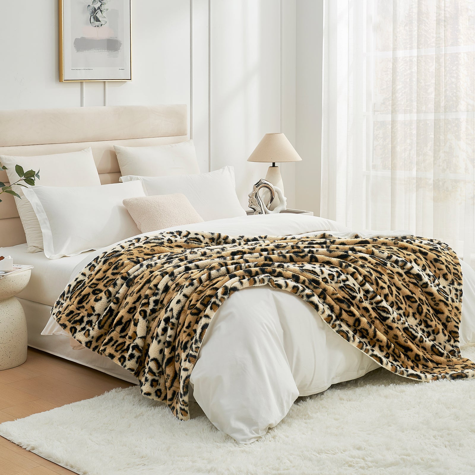 Leopard print milkyplush throw blanket in Brown Leopard layered on a bed, creating a warm and stylish bedroom look #color_Brown Leopard